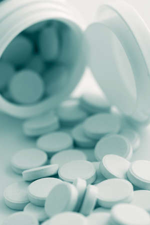 pills spilling out of bottleの写真素材