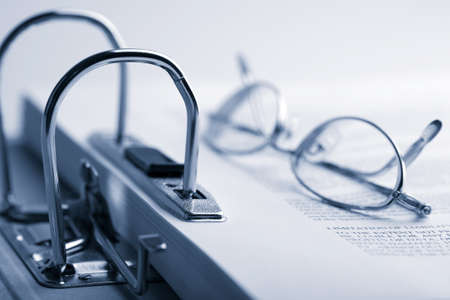open binder and glasses toned blueの写真素材