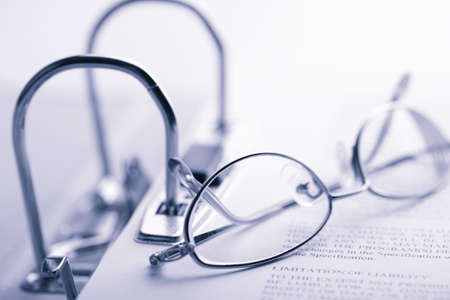 open binder and glasses toned blueの写真素材