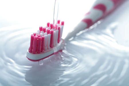 water splashing over toothbrushの写真素材