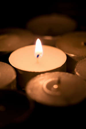 holiday candles burning in the darkの写真素材