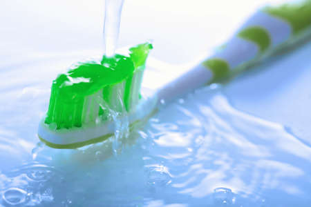 water splashing over toothbrushの写真素材