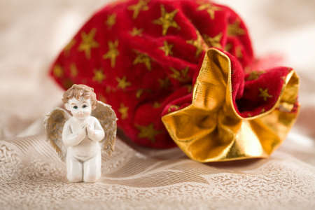porcelain angel and christmas sackの写真素材