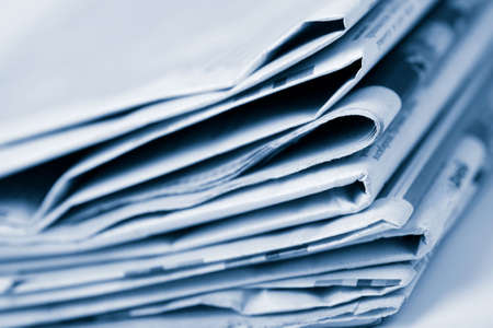 stack of newspapers toned blueの写真素材