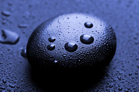 shiny zen stone with water dropsの写真素材