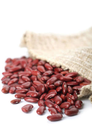 haricot beans falling out of sack isolatedの写真素材