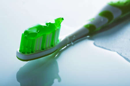  toothbrush with green pasteの写真素材