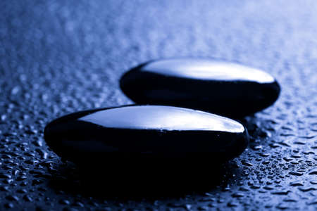shiny spa stones with water dropsの写真素材