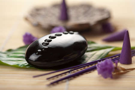 spa stone on green leafの写真素材