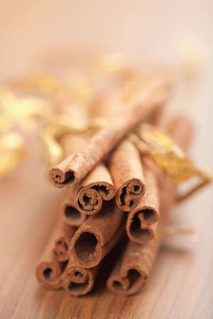 cinnamon with golden ribbonの写真素材