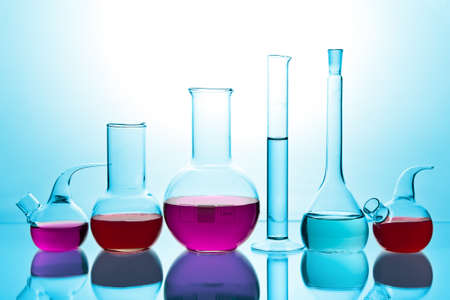 laboratory glassware with colorful chemicalsの写真素材