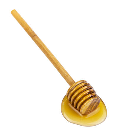 honey and wooden dipper isolated の写真素材