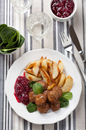 swedish meatballs with potatoes and lingon jamの写真素材