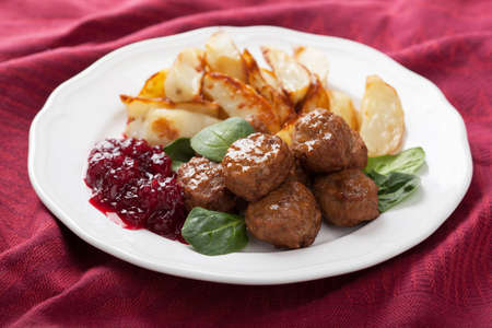swedish meatballs with potatoes and lingon jam の写真素材