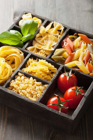 various pasta in black wooden box の写真素材
