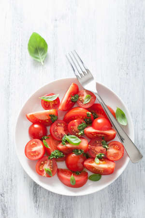 tomato salad with basil dressing の写真素材