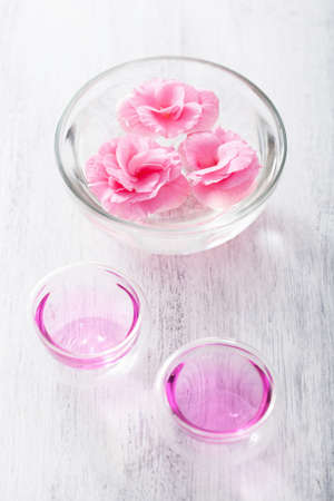 spa set with begonia flowers and essential oil の写真素材