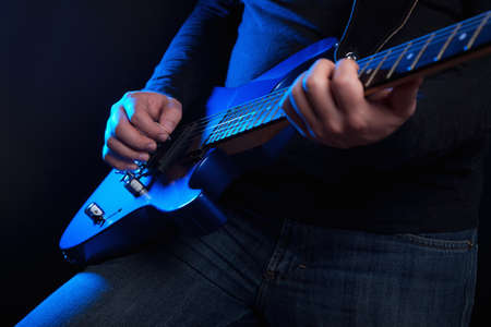 rock guitarist with blue guitarの写真素材