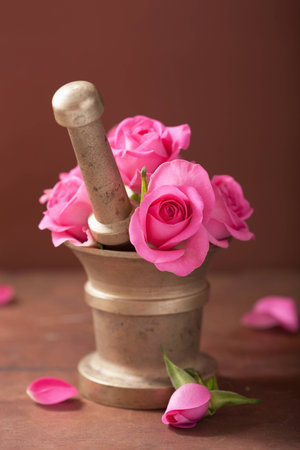 mortar with rose flowers for aromatherapy and spaの写真素材