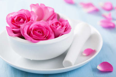 pink rose flowers in mortar for aromatherapy and spa の写真素材
