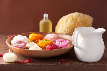 ranunculus flowers essential oil candles for spa の写真素材