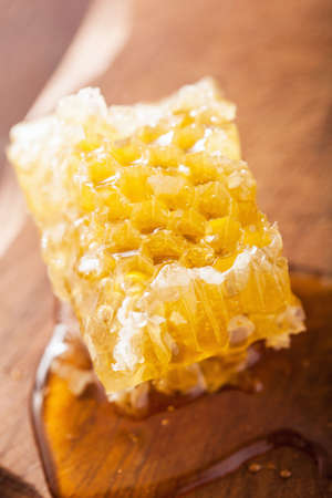 honeycomb on wooden backgroundの写真素材