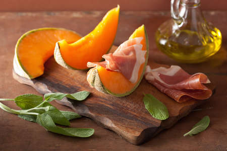 cantaloupe melon with prosciutto. italian appetizerの写真素材