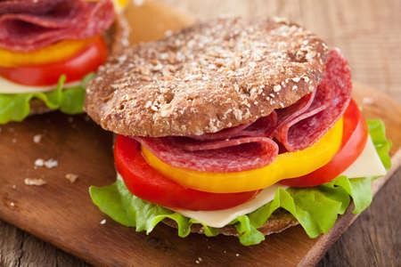 healthy sandwich with salami tomato pepper and lettuceの写真素材