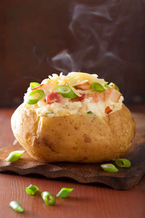 baked potato in jacket with bacon and cheese