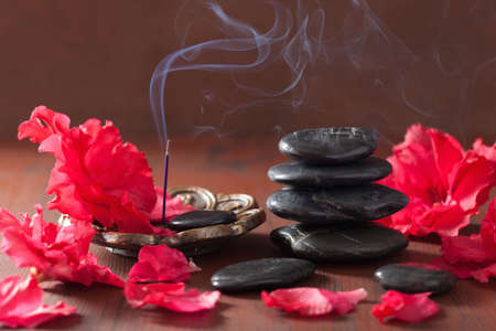 azalea flowers black massage stones incense sticks for aromatherapy spaの写真素材