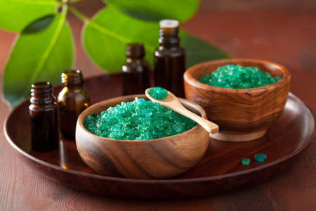 green herbal salt and essential oils for healthy spa bathの写真素材