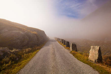Foggy and sunny road in Norway Gamle Strynefjellsvegenの写真素材