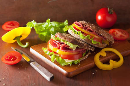 healthy sandwich with salami tomato pepper and lettuceの写真素材