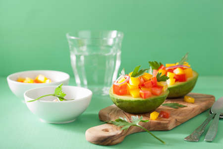 avocados stuffed with tomato pepper saladの写真素材