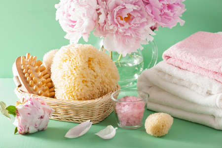 bath and spa with peony flowers brush sponge towels