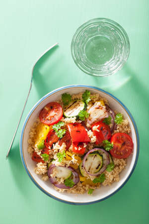 healthy couscous salad with grilled tomato pepper zucchini onionの写真素材