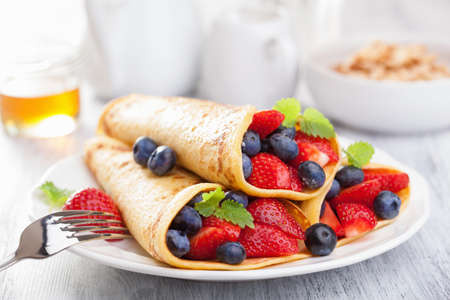 pancakes with strawberry blueberryの写真素材