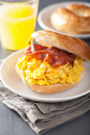 breakfast sandwich on bagel with egg bacon cheeseの写真素材