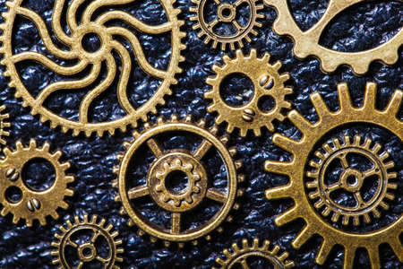 steampunk mechanical cogs gears wheels on leather background