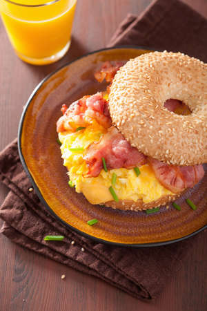breakfast sandwich on bagel with egg bacon cheeseの写真素材