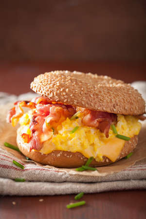 breakfast sandwich on bagel with egg bacon cheeseの写真素材
