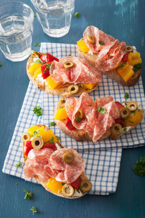 salami bruschetta with roasted peppers goat cheese olivesの写真素材