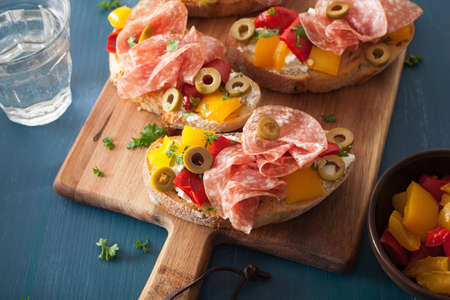 salami bruschetta with roasted peppers goat cheese olivesの写真素材