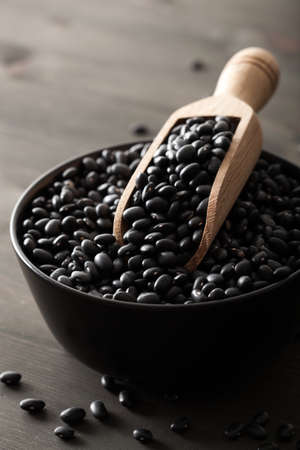 black turtle beans legumes in bowlの写真素材