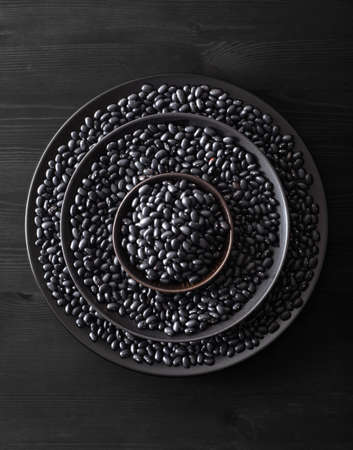 black turtle beans legumes in bowlsの写真素材