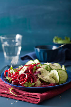 spiralized beet and cucumber salad with avocado dressing, healthy vegan mealの写真素材