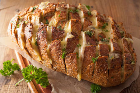 baked party bread with melted cheese butter herbs