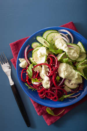 spiralized beet and cucumber salad with avocado dressing, healthy vegan mealの写真素材