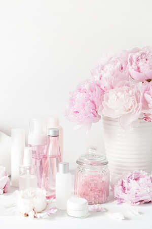 bath and spa with peony flowers beauty products towelsの写真素材