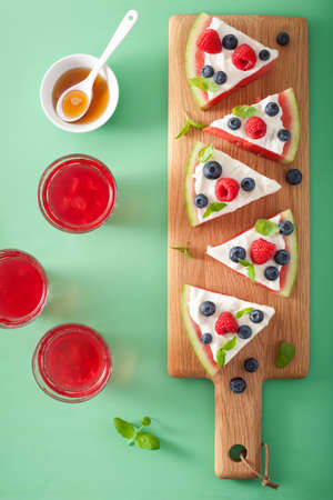 watermelon pizza slices with yogurt and berries, summer dessert